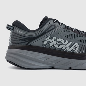 Hoka men's running trainer in Outer Orbit Satellite grey colourway, chunky cushioned midsole, mesh upper with black overlays, close-up heel detail