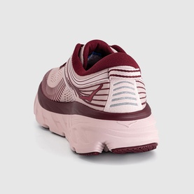 Blush pink and burgundy running trainer, rear view showing padded collar, reflective detail, and chunky midsole
