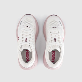 Hoka trainers in white and pink opal, top-down view showing mesh upper, branded insole, and pink midsole