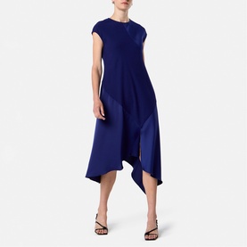 Model wearing Helen McAlinden Ink Blue midi dress with cap sleeves and asymmetric draped hem, styled with strappy heeled sandals.