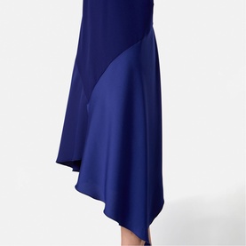 Helen McAlinden ink blue asymmetric midi skirt with contrasting satin panel, shown as a close-up detail shot.