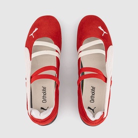 Puma red suede ballet flats with cream cross-strap detail, OrthoLite insole visible, overhead flat lay view