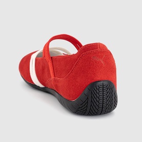 Red suede mary jane flat with white stripe detail, elasticated strap, and black rubber sole, shown from rear angle