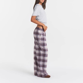 Model wearing Skims PJ Pants in Iris Mica Plaid, wide-leg flannel check trousers with elasticated waist, styled with a grey crop tee.