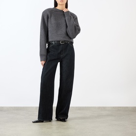 Model wearing The Frankie Shop dark grey wool-blend cropped jumper with wide-leg black trousers and black leather belt.
