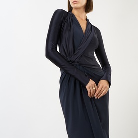 Model wearing Victoria Beckham Lea Gathered Wrap Dress in navy, featuring draped V-neckline, long sleeves and gathered side detail