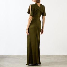 Model wearing Victoria Beckham Dark Green Gown, shown from behind, featuring cut-out shoulder detail and floor-length silhouette.