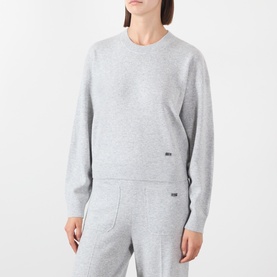 Model wearing Victoria Beckham Grey Marl merino wool cashmere crew neck sweatshirt, styled with matching grey marl joggers.
