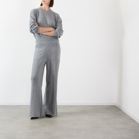 Model wearing Victoria Beckham Mid Grey Marl merino wool cashmere blend knit top and wide-leg trousers set