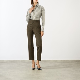 Model wearing Victoria Beckham Patch Pocket Striped Shirt with khaki tailored trousers and black heels