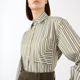 Model wearing Victoria Beckham Patch Pocket Striped Shirt in khaki and white stripes, with point collar and chest patch pocket, styled with olive