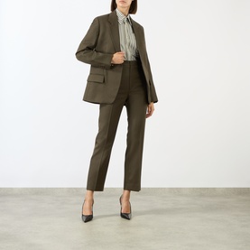 Model wearing Victoria Beckham Straight Leg Cropped Trousers in gold wool, styled with matching blazer, striped shirt and black heels
