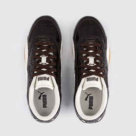 Puma dark brown and cream low-top trainers, overhead view showing textured upper, brown laces, and branded tongue labels.