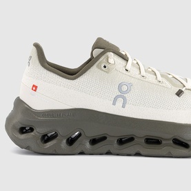 On Running trainer in Fern Grain colourway, white mesh upper with sage green heel counter and chunky grey CloudTec sole.