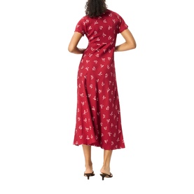 Model wearing Whistles red floral print midi dress with short sleeves and flared skirt, styled with black heeled mules.