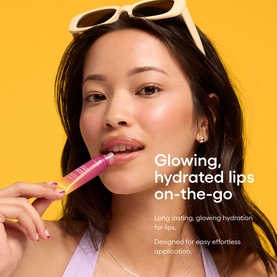 Model wearing Laneige Lip Glowy Balm Mango Acai Smoothie, applying pink lip balm, styled with yellow-framed sunglasses on head.