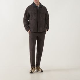 Model wearing Snow Peak Dark Brown Casual Jacket with matching trousers and khaki trainers