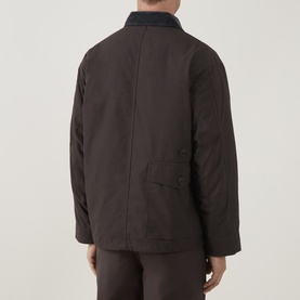 Model wearing Snow Peak Dark Brown Casual Jacket, rear view, with contrasting collar detail and side patch pocket