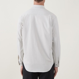 Model wearing Snow Peak ivory casual shirt, rear view, long sleeves with contrast button cuffs