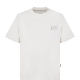 Snow Peak ivory T-shirt with small chest logo print, crew neck, short sleeves, and woven label tab at hem