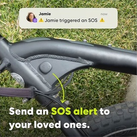 Close-up of a black bike handlebar with SOS alert feature highlighted, showing a phone notification from a contact named Jamie.