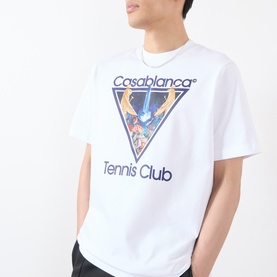 Model wearing white Casablanca Tennis Club graphic T-shirt with triangle print, styled with a silver chain necklace.