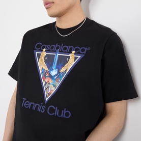 Model wearing black Casablanca Tennis Club graphic T-shirt with triangle print, styled with a gold chain necklace.