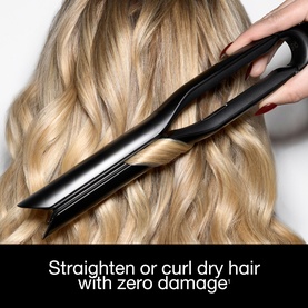 GHD hair straightener used to curl long blonde hair, with text overlay: Straighten or curl dry hair with zero damage