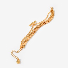 Mint Velvet gold multi-strand chain bracelet with box chain layers, toggle clasp, and charm drop extender chain.