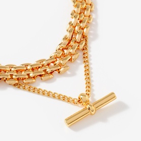 Mint Velvet gold layered chain necklace with T-bar pendant, featuring mixed box and curb chain links