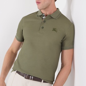 Model wearing Burberry olive cotton polo shirt with check placket detail and embroidered Equestrian Knight logo on chest