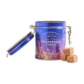 Cartwright & Butler Gingerbread Fudge in blue clip-top tin with festive village design, shown with fudge pieces beside it.