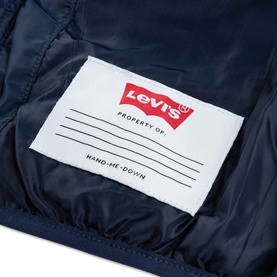 Levi's children's outerwear in Naval Academy navy, close-up of white label reading "Property Of" and "Hand-Me-Down