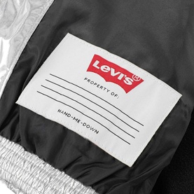 Levi's children's silver metallic outerwear interior label detail reading "Property Of" and "Hand-Me-Down