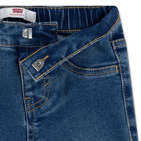 Levi's baby denim jeans in mid-blue wash, close-up detail showing waistband, pocket and contrast stitching