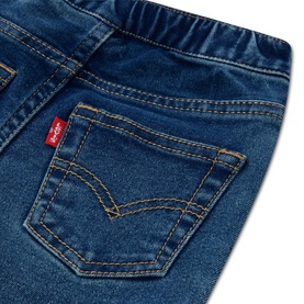 Levi's baby denim jeans in medium blue wash, close-up of back pocket with red Levi's tab and gold stitching detail