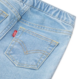 Levi's baby Naval Academy light blue denim jeans close-up showing back pocket with signature red tab and yellow stitching detail