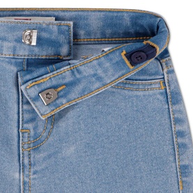 Levi's baby denim jeans in light blue wash, close-up showing branded button fastening and contrast stitching detail