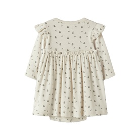 Lil Atelier baby dress in Turtledove, long-sleeve with frill shoulders and gathered waist, allover floral print, back view.