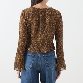 Model wearing Paige Hickory Multi silk blouse, back view, floral print, flared cuffs, styled with blue jeans