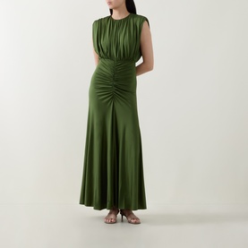 Model wearing Self-Portrait olive maxi dress with ruched bodice and front, sleeveless style, styled with strappy heeled sandals.