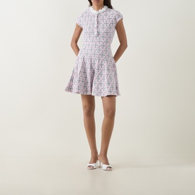 Model wearing Self-Portrait Pink Checked Knit Dress with cap sleeves, collared neckline and drop-waist skirt, styled with white heeled mules.