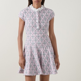 Model wearing Self-Portrait Pink Checked Knit Dress with frill collar, cap sleeves and flared skirt in cotton blend fabric.