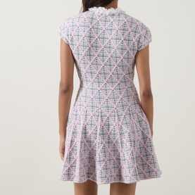 Model wearing Self-Portrait Pink Checked Knit Dress, rear view, featuring cap sleeves, fitted bodice and flared skirt.