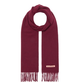Acne wool scarf in Burgundy Melange with fringe ends and logo patch, neatly folded and coiled flat lay