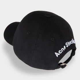 Acne Studios Back Logo Baseball Cap in black, rear view showing white logo script, curved brim, silver adjustable clip fastening