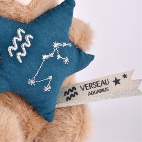 Histoire d'Ours Aquarius zodiac plush accessory, teal star-shaped cushion with silver constellation embroidery and woven label.