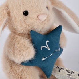 Histoire d'Ours cream bunny plush holding a teal star with Aries constellation embroidery and silver detailing
