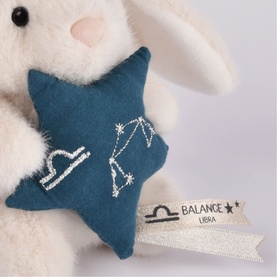 Histoire d'Ours cream plush bunny holding teal felt star with Libra constellation embroidery and Balance label
