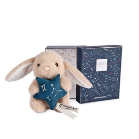 Histoire d'Ours cream bunny plush toy holding a teal star, shown with navy constellation-print gift box